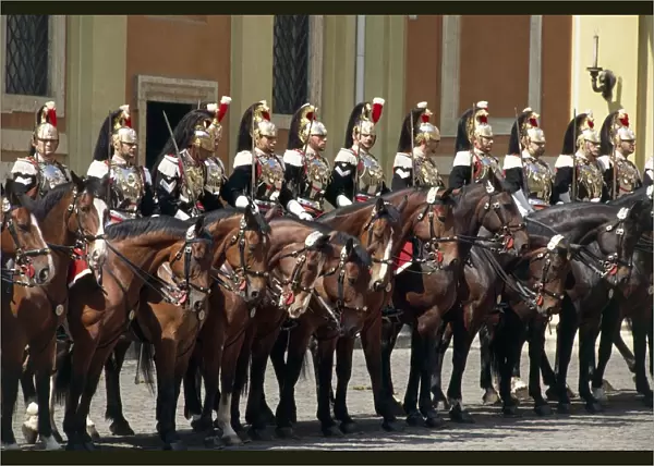 Cuirassiers on horseback standing in row