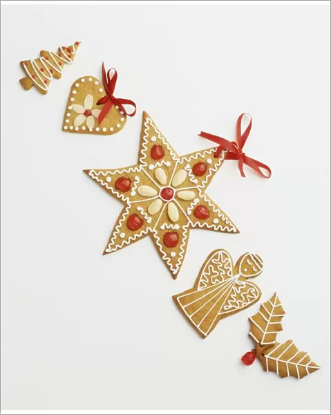 Decorative Christmas biscuits in the shapes of a Christmas tree, heart, star, angel and holly leaves