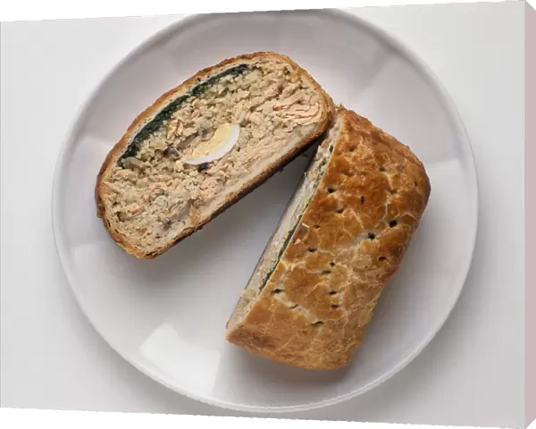 Kulebyaka, Russian pie enclosed in pastry, filled with salmon, rice, egg and mushrooms