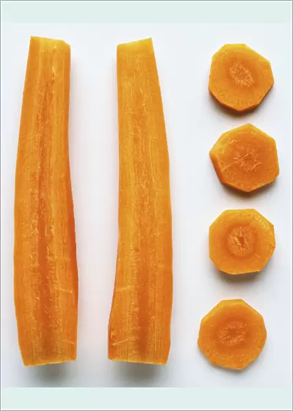 A carrot cut in half lengthways and a row of carrot slices