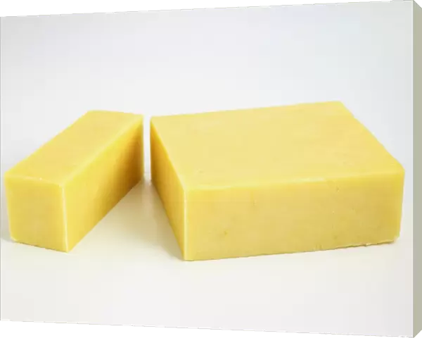 Sliced block of New Zealand cheddar cows milk cheese