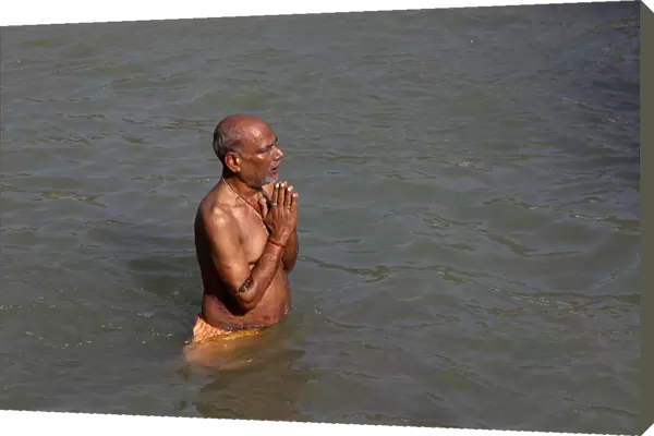 Pilgrim bathing in the Ganges