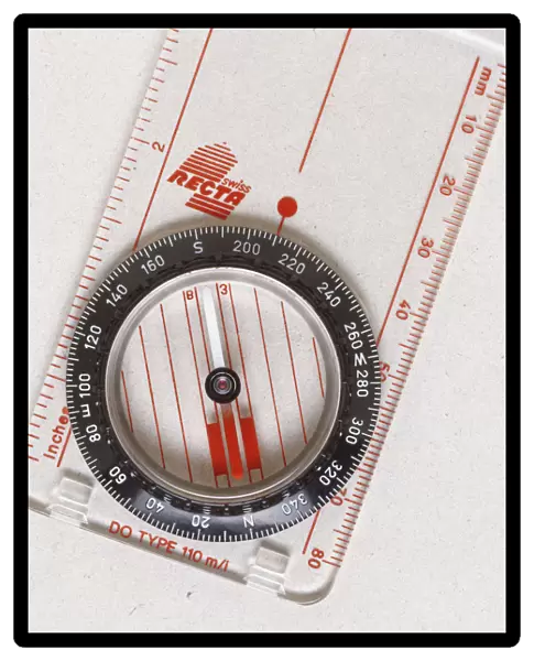 Above view of a magnetic compass the needle always points north and south because of the earths magnetic field