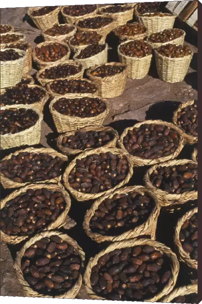 Morocco, Ziz Gorge, Phoenix dactylifera, Dates, displayed for sale in large wicker baskets, high angle view