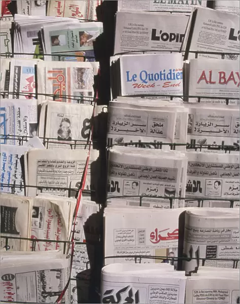 North Africa, Morocco, newspaper vendors display with newspapers in Latin and Arabic script, close up