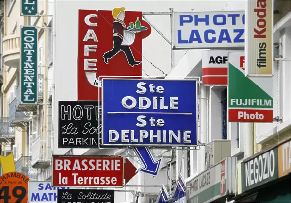 Shop and hotel signs in Lourdes