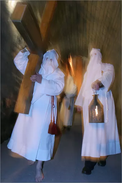 White penitentss Easter week procession in Le Puy en Velay