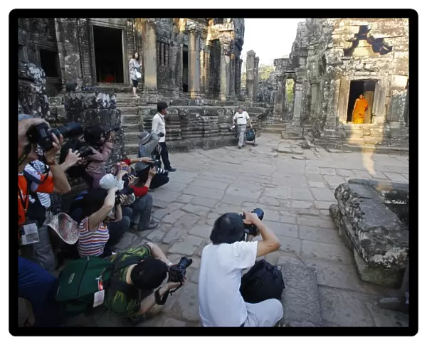 Photographs shooting a monk at Bayon temple