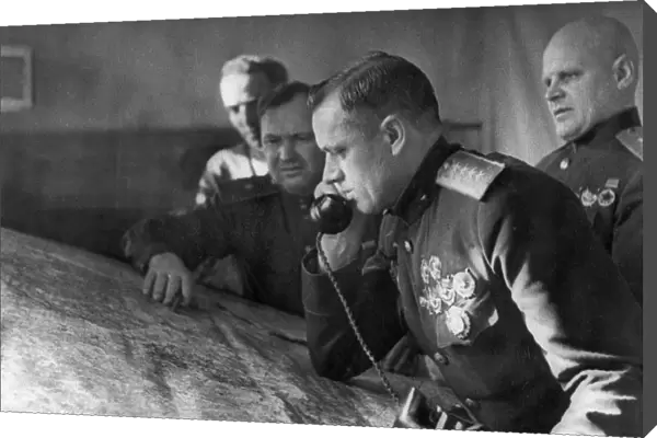 General konstantin rokossovsky, commander of the first byelorussian front, on the phone prior to the battle for stalingrad, on the right is lieutenant general telegin, member of the military council of the front