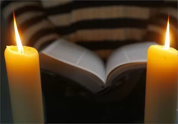 Bible and 2 candles