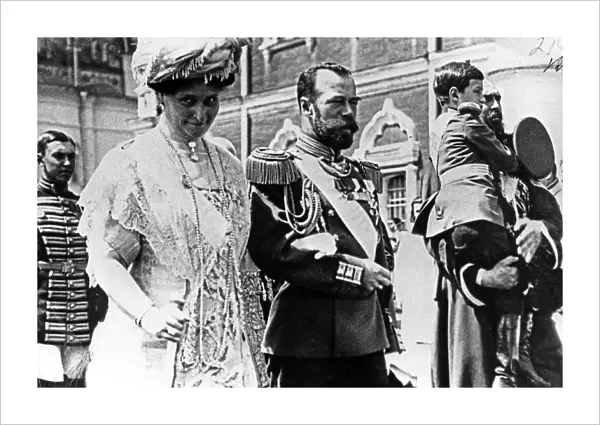 The royal couple of russia, tsar nicholas ll and tsarina alexandra fyodorovna, walking from the assumption cathedral to the nikolayevsky palace, may 25, 1913, the boy is their son, prince alexei