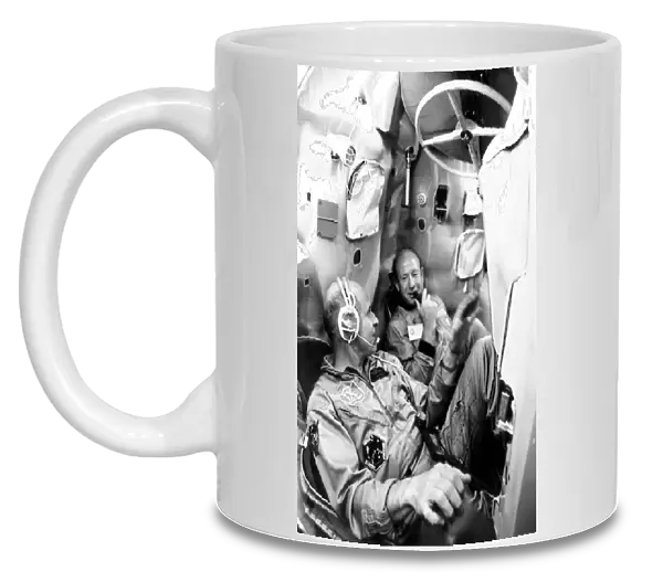July 9, 1974, yuri gagarin spacemens training centre, alexei leonov, commander of the first soyuz crew (right), thomas stafford, commander of the apollo flight crew, training in a mock-up soyuz spacecraft