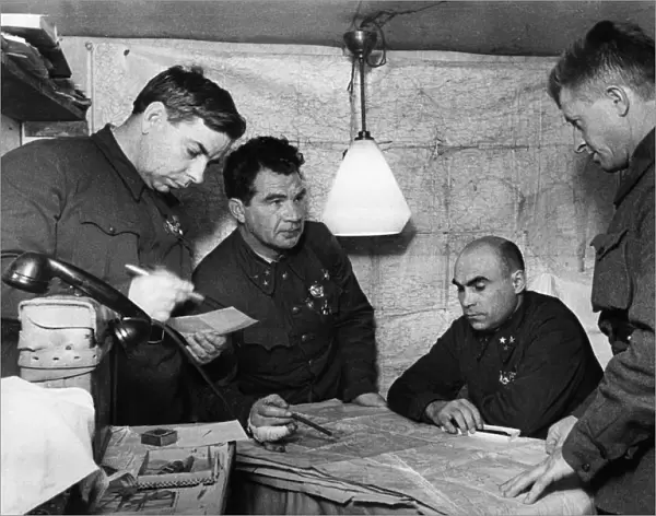 Lt, general vasili chuikov (2nd from left) giving an assignment to the commander of the 13th guards rifle division, major general alexander rodimtsev (far right), in the command post bunker of the 62nd army in november 1942, stalingrad, also present are major general n, i, krylov (far left) and member of the military council, lt, general k, a, gurov (2nd from right)