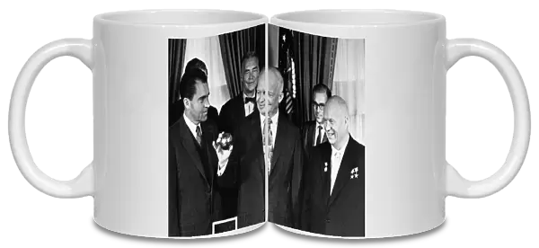 Nikita khrushchev with president dwight d, eisenhower and vice-president richard m, nixon at the whitehouse on september 16, 1959, khrushchev just presented the president with a copy of the pendant that was deposited on the moon by a soviet space rocket (luna 2)