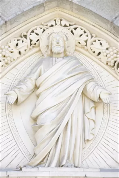 Christ sculpture on church tympanum