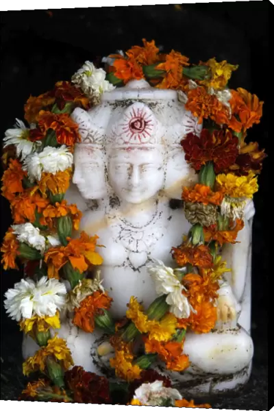 Garlanded Brahma sculpture