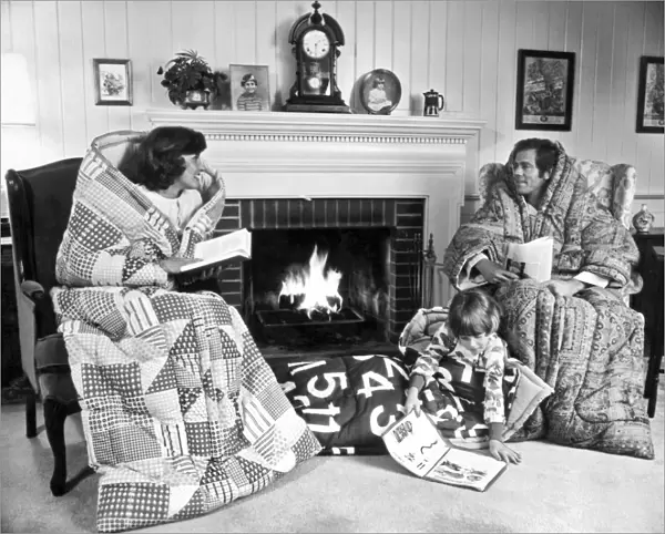 Family Huddled By Fireplace