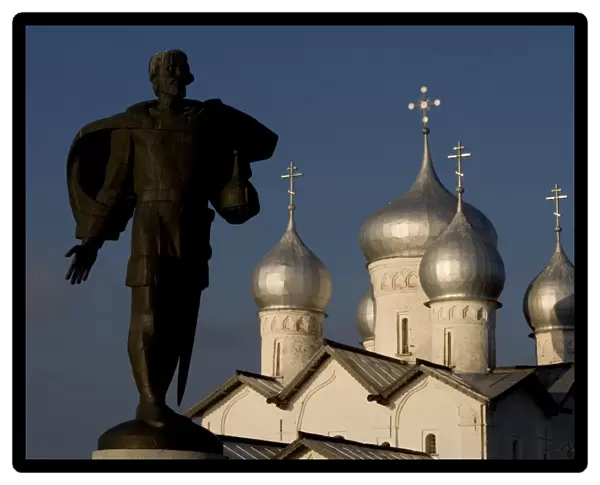 Russia, Veliky Novgorod, Alexander Nevsky statue and domes of church of Saints Boris and Gleb