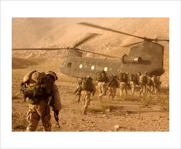 Soldiers board a Chinook helicopter in the invasion of Afghanistan 2001 US 10th Mountain