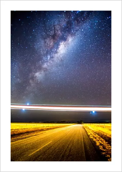 Stargazing; Lights of a low flying plane over an outback Australian road