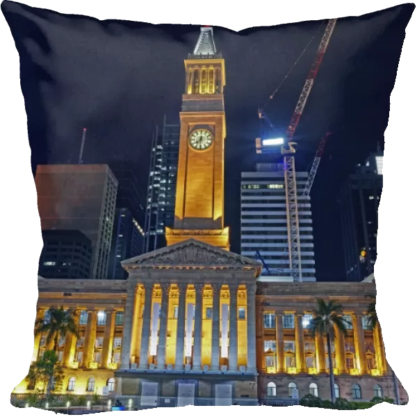 Facade of Brisbanes City hall illuminated at night