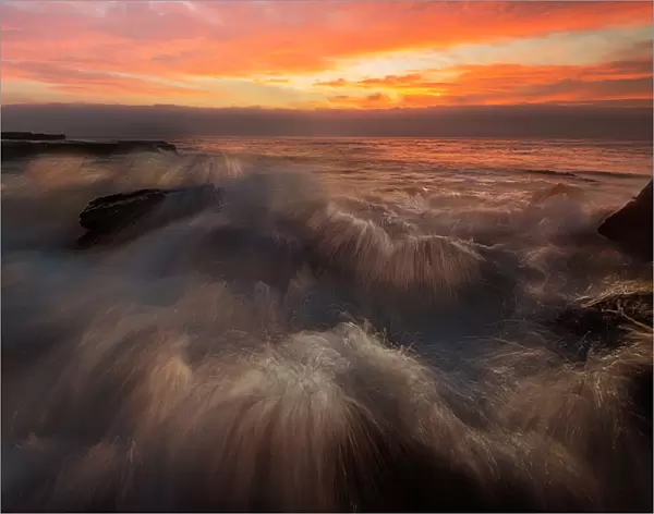 Powerful Waves crushing on a rocky beach