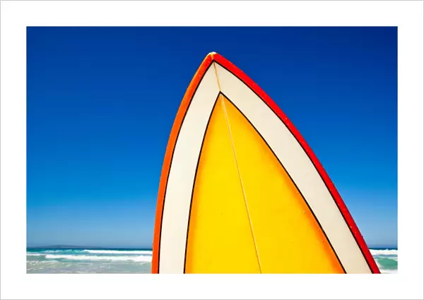 Retro surf board at beach, Australia