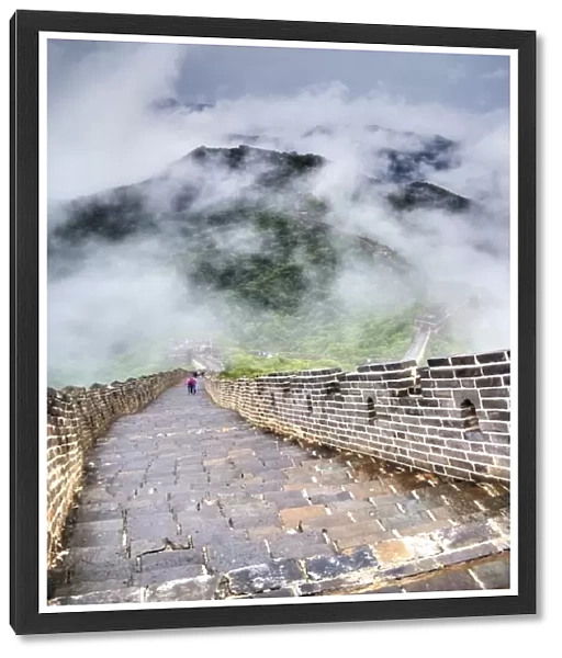 Famous Great Wall covered in fog and clouds