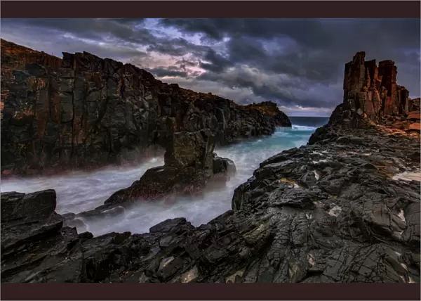 Dramatic rocky seascape sunset
