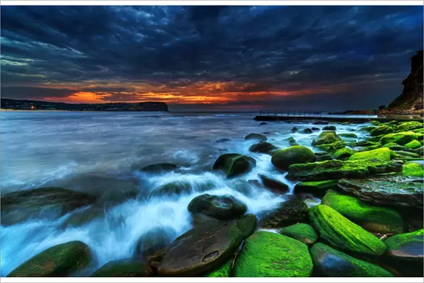 Green rocks moody sunrise