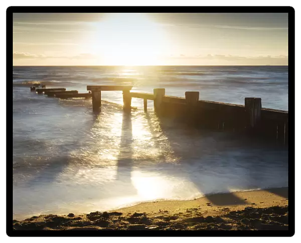 Sunset view of pier ruins at Mentone beach, Melbourne