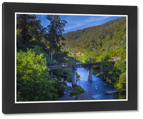 A scenic view of the Thomson river and historic railway bridge, Central Gippsland