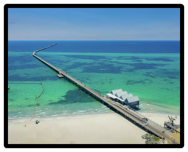 Aerial view of Busselton Jetty on a sunny day with tourists in front of souvenir shop in