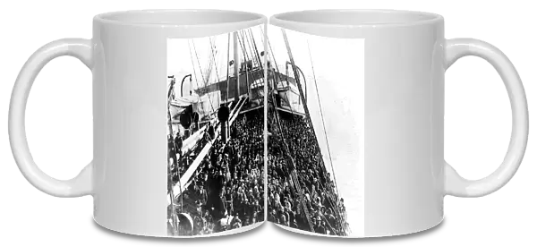 Coming To America; Immigrants pack the upper deck of the liner SS Patricia as it