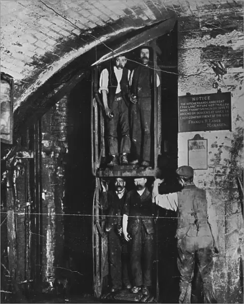 Going Up. circa 1900: Miners going up in the lift at the end of their shift