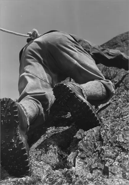 A climber making his way up a rock face