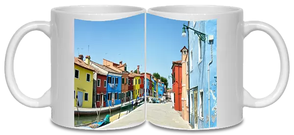 Canals of Burano with boats & colorful buildings