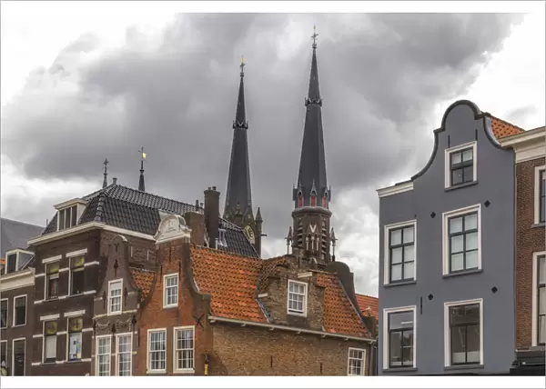 Gabled houses in Delft under a dramatic sky