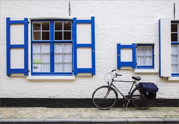 Bike parked near house in Bruges, Belgium