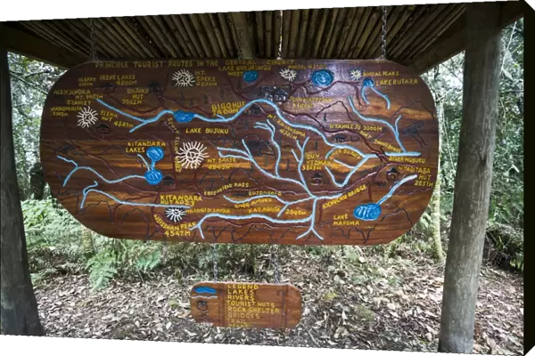 Wooden sign depicting hiking trails of the Central Circuit, Rwenzori Mountains, Uganda