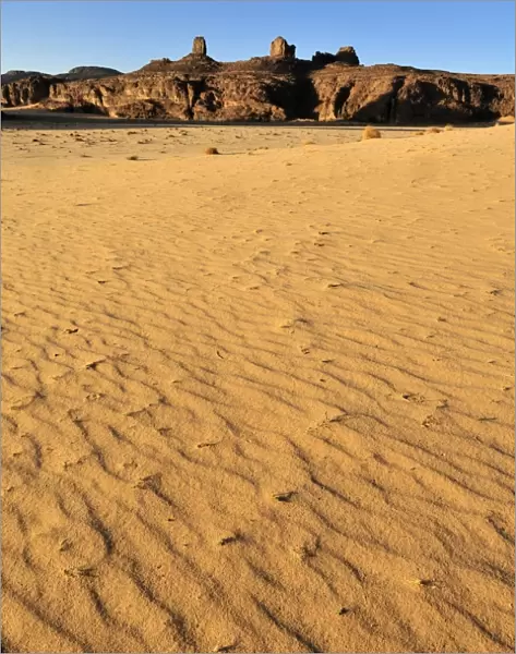 Sandstone rock formation and dunes on Tasset Plateau, Tassili n Ajjer National Park, Unesco World Heritage Site, Wilaya Illizi, Algeria, Sahara desert, North Africa