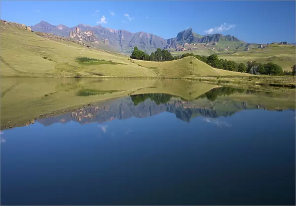 A dam reflecting the Drakensberg mountains, Drakensberg Park, KwaZulu-Natal, South Africa