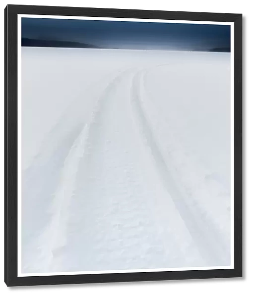 Snow mobile path on frozen Akan lake