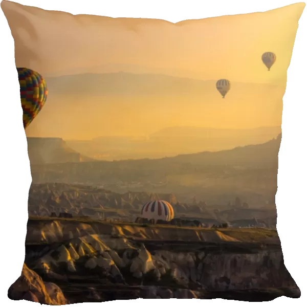 hot air balloons over cappadocia landscape
