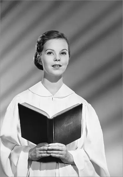 Woman choir singer holding songbook