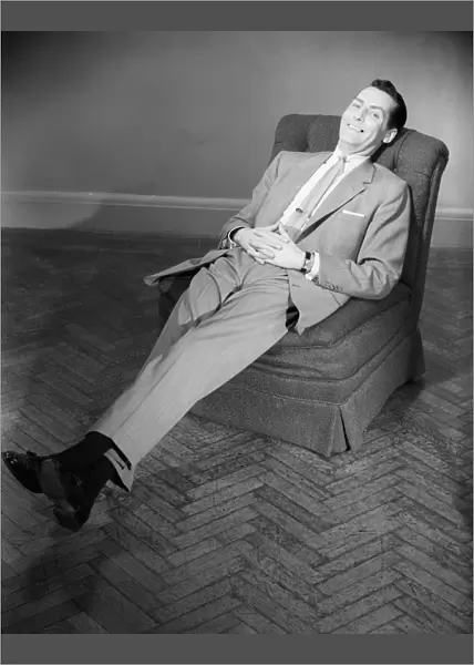 Man relaxing in armchair