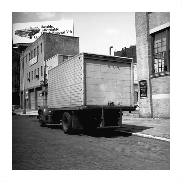Truck parked at sidewalk, (rear view), (B&W)