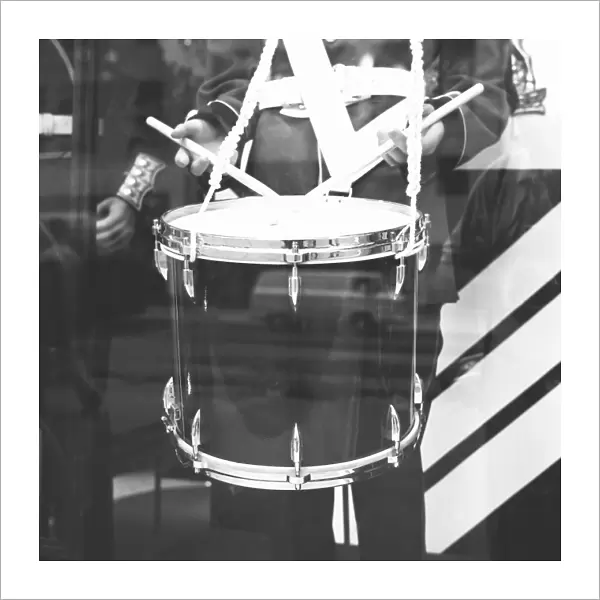 Military band drummer, reflection in window, (B&W), (mid section)
