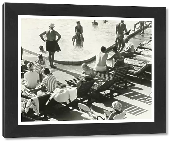Group of people at swimming pool, (B&W), elevated view