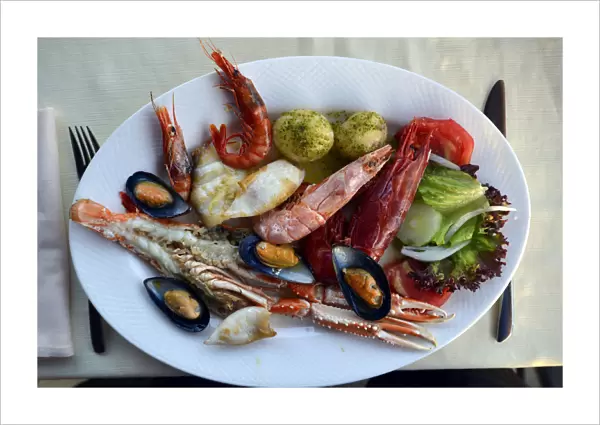 Typical fish dish with shrimps, mussels, whiting, octopus, boiled potatoes, Lanzarote, Canary Islands, Spain